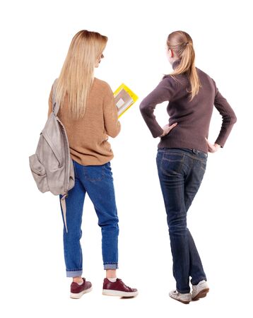 Back view of two woman in sweater. beautiful friendly girl and guy together. Rear view people collection. backside view of person. Isolated over white background.の写真素材