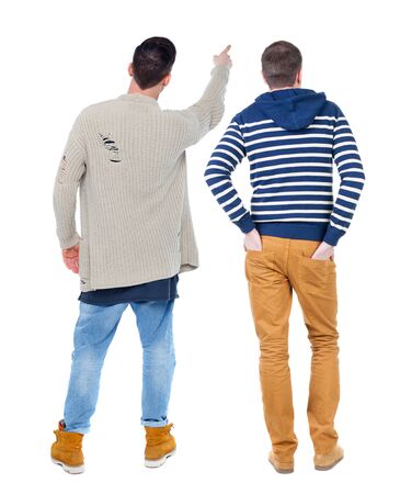 Back view of two man in sweater pointing. Rear view people collection. backside view of person. Isolated over white background.の写真素材