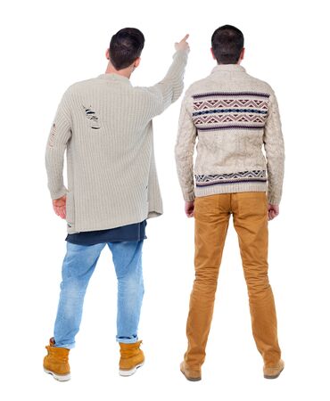 Back view of two man in sweater pointing. Rear view people collection. backside view of person. Isolated over white background.の写真素材
