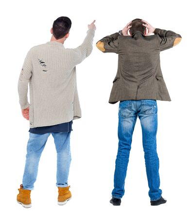 Back view of two man in sweater pointing. Rear view people collection. backside view of person. Isolated over white background.の写真素材