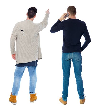 Back view of two man in sweater with mobile phone. Rear view people collection. backside view of person. Isolated over white background.の写真素材