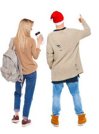 Back view of couple couple in sweater showing thumbs up. beautiful friendly girl and guy together. Rear view people collection. backside view of person. Isolated over white background.の写真素材