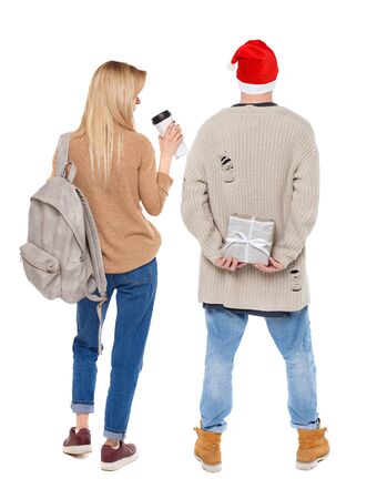 Back view of couple in sweater. beautiful friendly girl and guy together. Rear view people collection. backside view of person. Isolated over white background.の写真素材