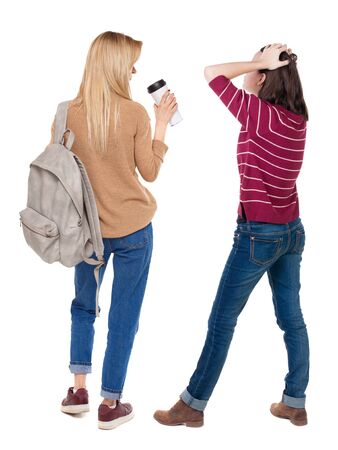 Back view of two woman in sweater. beautiful friendly girl and guy together. Rear view people collection. backside view of person. Isolated over white background.の写真素材