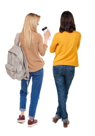 Back view of two woman in sweater. beautiful friendly girl and guy together. Rear view people collection. backside view of person. Isolated over white background.の写真素材