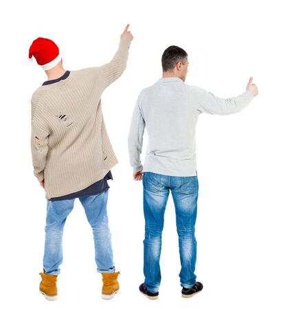 Back view of two man in sweater pointing. Rear view people collection. backside view of person. Isolated over white background.の写真素材