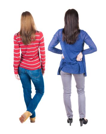 Back view of two woman in sweater. beautiful friendly girl and guy together. Rear view people collection. backside view of person. Isolated over white background.の写真素材