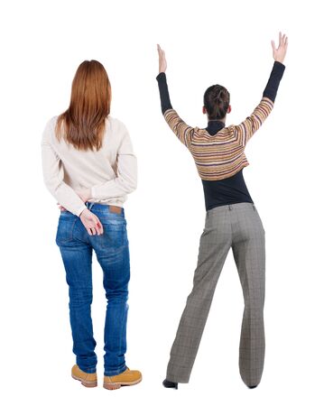 Back view of two woman in sweater. beautiful friendly girl and guy together. Rear view people collection. backside view of person. Isolated over white background.の写真素材