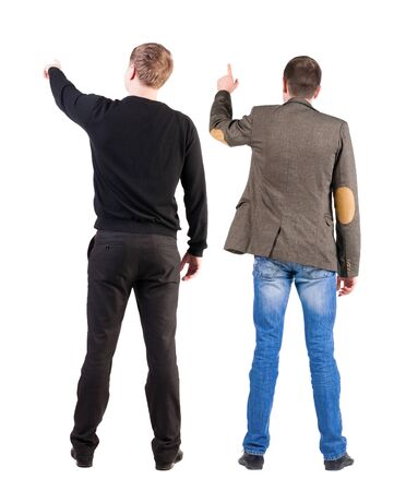 Back view of two man in sweater pointing. Rear view people collection. backside view of person. Isolated over white background.の写真素材