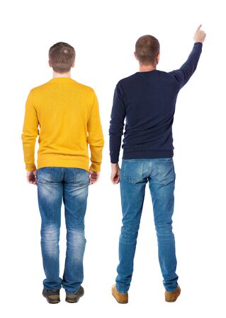 Back view of two man in sweater pointing. Rear view people collection. backside view of person. Isolated over white background. Guys stare aheadの写真素材