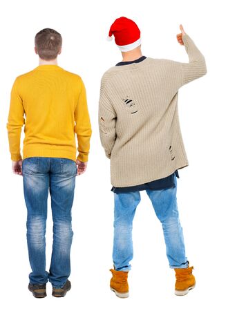 Back view two man in sweater showing thumb up. Rear view people collection. backside view of person. Isolated over white background.の写真素材