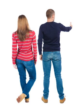 Back view of couple in sweater showing thumbs up. beautiful woman and man together. Rear view people collection. backside view of person. Isolated over white background.の写真素材