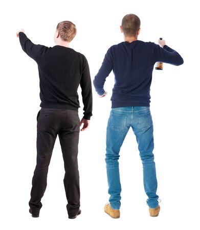 Back view of two man in sweater pointing. Rear view people collection. backside view of person. Isolated over white background. Guys stare aheadの写真素材