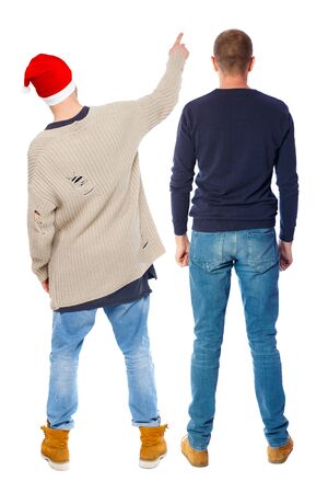 Back view of two man in sweater pointing. Rear view people collection. backside view of person. Isolated over white background. Guys stare aheadの写真素材