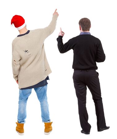 Back view of two man in sweater pointing. Rear view people collection. backside view of person. Isolated over white background. Guys stare aheadの写真素材