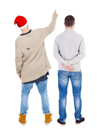Back view of two man in sweater pointing. Rear view people collection. backside view of person. Isolated over white background. Guys stare aheadの写真素材