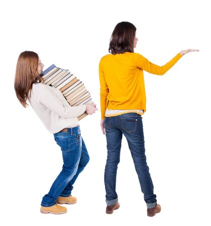 Back view of two woman in sweater. Rear view people collection. backside view of person. Isolated over white background. Girls are looking forwardの写真素材