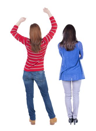 Back view of two woman in sweater. Rear view people collection. backside view of person. Isolated over white background. Girls are looking forwardの写真素材