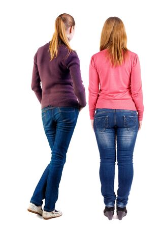 Back view of two woman in sweater. Rear view people collection. backside view of person. Isolated over white background. Girls are looking forwardの写真素材