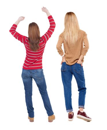 Back view of two woman in sweater. Rear view people collection. backside view of person. Isolated over white background. Girls are looking forwardの写真素材