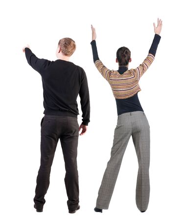 Back view of couple in sweater pointing. Rear view people collection. backside view of person. Isolated over white background.の写真素材