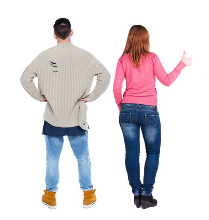 Back view of couple in sweater showing thumbs up. beautiful woman and man together. Rear view people collection. backside view of person. Isolated over white background.の写真素材