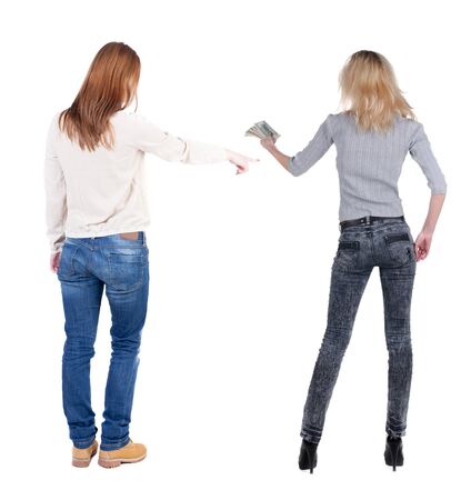 Back view of two pointing girl in sweater. Rear view people collection. backside view of person. beautiful woman showing gesture. Rear view. Isolated over white background.の写真素材