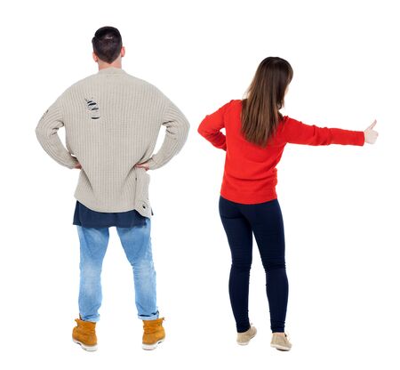 Back view of couple in sweater showing thumbs up. beautiful woman and man together. Rear view people collection. backside view of person. Isolated over white background.の写真素材
