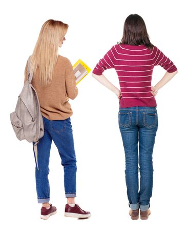 Back view of two woman in sweater. Rear view people collection. backside view of person. Isolated over white background. Girls are looking forwardの写真素材
