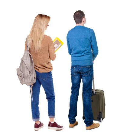 young couple in sweater traveling with suitcas. Back view. Rear view people collection. backside view of person. Isolated over white background.の写真素材