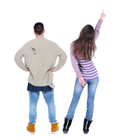 Back view of couple in sweater pointing. Rear view people collection. backside view of person. Isolated over white background.の写真素材