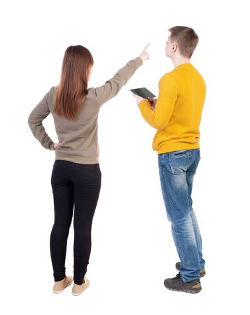 Back view of couple in sweater with mobile phone. beautiful friendly girl and guy together. Rear view people collection. backside view of person. Isolated over white background.の写真素材