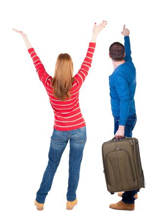 young couple in sweater traveling with suitcas. Back view. Rear view people collection. backside view of person. Isolated over white background.の写真素材