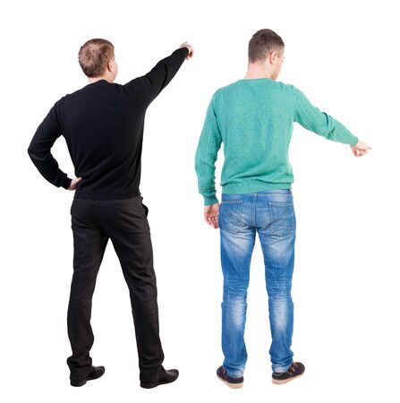 Back view of two man in sweater pointing. Rear view people collection. backside view of person. Isolated over white background. Guys stare aheadの写真素材