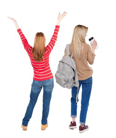 Back view of two woman in sweater. Rear view people collection. backside view of person. Isolated over white background. Girls are looking forwardの写真素材