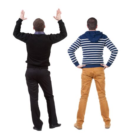 Back view two man in sweater. Rear view people collection. backside view of person. Isolated over white background. Guys looking forwardの写真素材