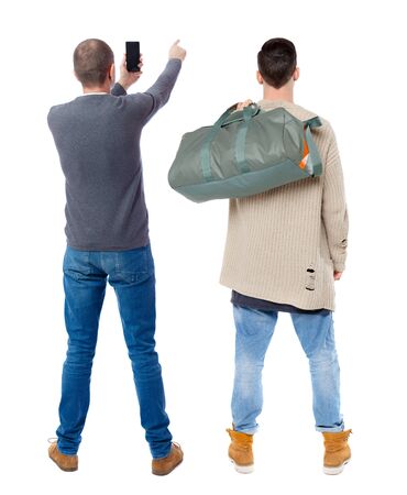 Back view of two man in sweater with mobile phone. Rear view people collection. backside view of person. Isolated over white background.の写真素材