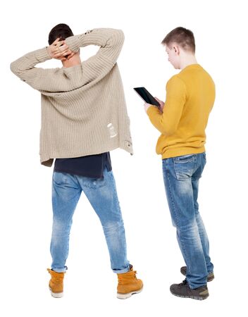 Back view of two man in sweater with mobile phone. Rear view people collection. backside view of person. Isolated over white background.の写真素材