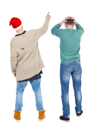 Back view of two man in sweater pointing. Rear view people collection. backside view of person. Isolated over white background. Guys stare aheadの写真素材