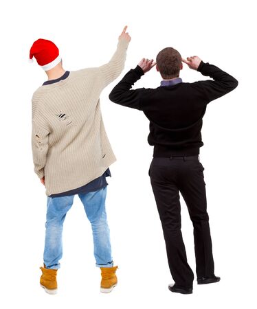 Back view of two man in sweater pointing. Rear view people collection. backside view of person. Isolated over white background. Guys stare aheadの写真素材