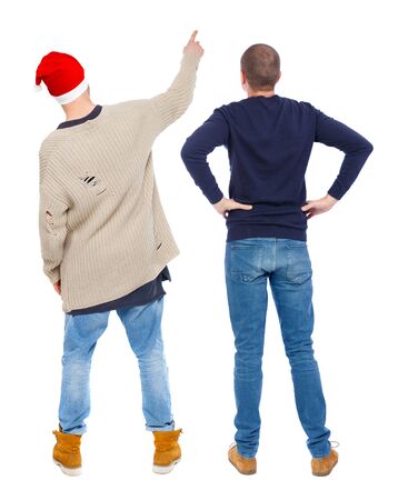 Back view of two man in sweater pointing. Rear view people collection. backside view of person. Isolated over white background. Guys stare aheadの写真素材