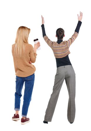 Back view of two woman in sweater. Rear view people collection. backside view of person. Isolated over white background. Girls are looking forwardの写真素材