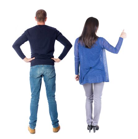 Back view of couple in sweater showing thumbs up. beautiful woman and man together. Rear view people collection. backside view of person. Isolated over white background.の写真素材