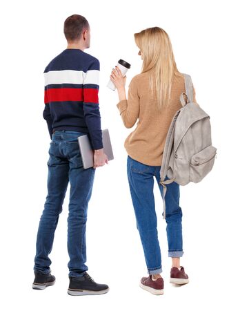 Back view couple with laptop in sweater. beautiful man and woman. Rear view people collection. backside view of person. Isolated over white background.の写真素材