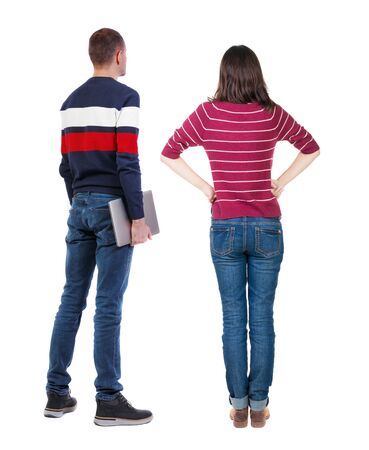 Back view couple with laptop in sweater. beautiful man and woman. Rear view people collection. backside view of person. Isolated over white background.の写真素材