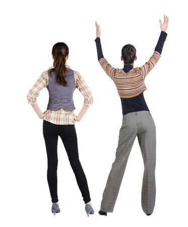 Back view of two woman in sweater. Rear view people collection. backside view of person. Isolated over white background. Girls are looking forwardの写真素材