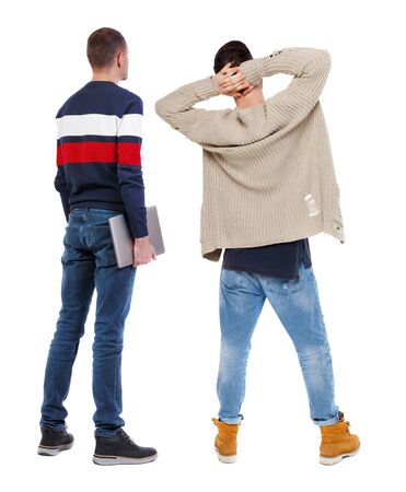Back view two man in sweater with laptop. Rear view people collection. backside view of person. Isolated over white background. Guys looking forwardの写真素材