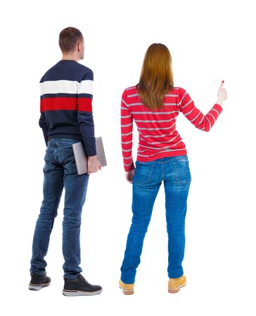 Back view couple with laptop in sweater. beautiful man and woman. Rear view people collection. backside view of person. Isolated over white background.の写真素材