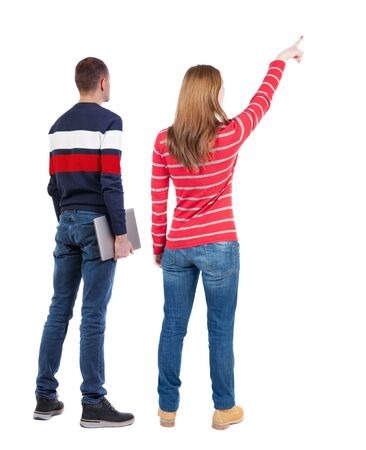 Back view couple with laptop in sweater. beautiful man and woman. Rear view people collection. backside view of person. Isolated over white background.の写真素材