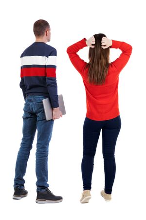 Back view couple with laptop in sweater. beautiful man and woman. Rear view people collection. backside view of person. Isolated over white background.の写真素材